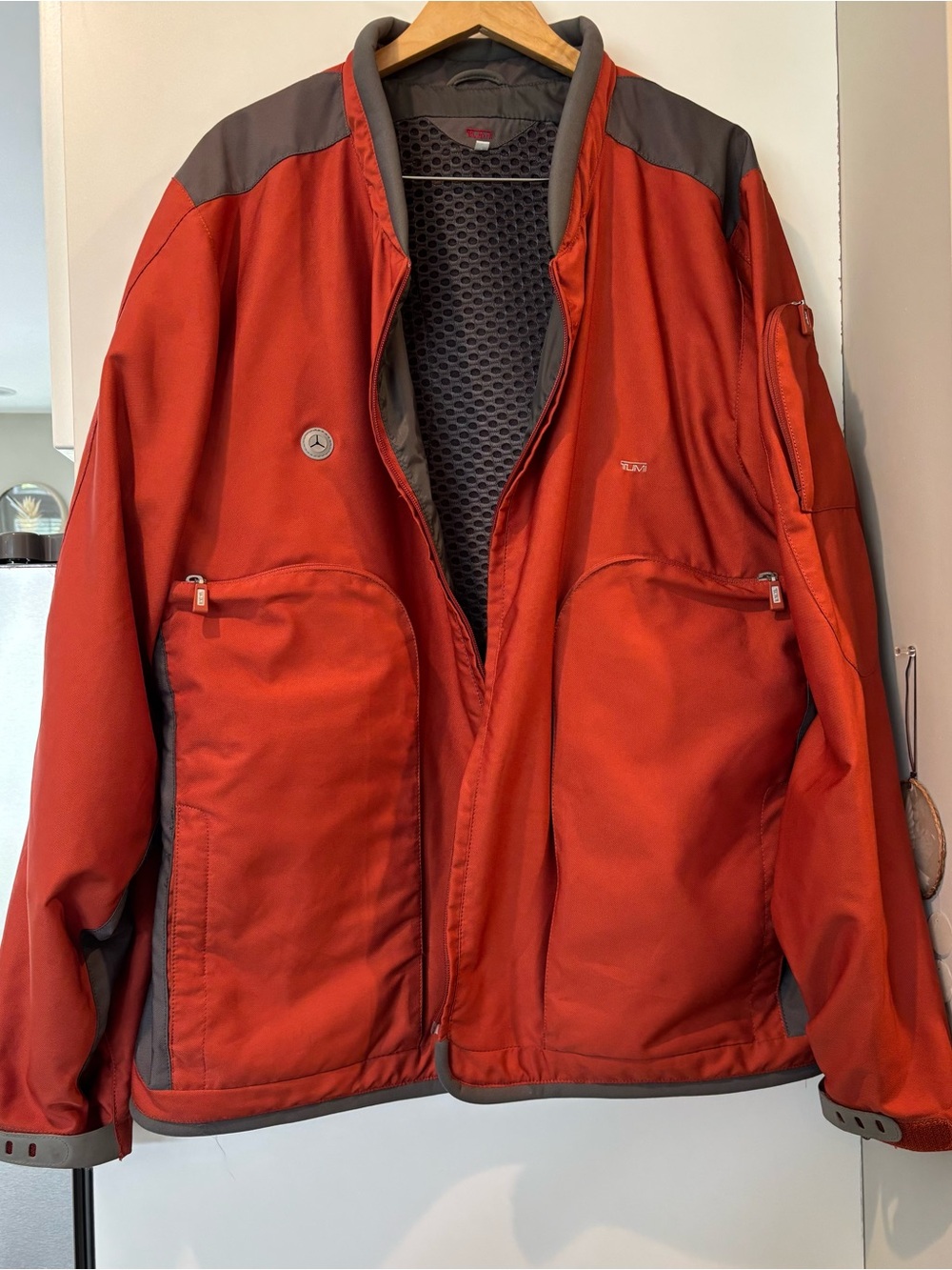 Vintage Y2K Tumi men’s Technical Stash Pocket Travel Jacket in burnt orange!